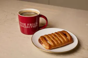 coffee cup and pastry on plate