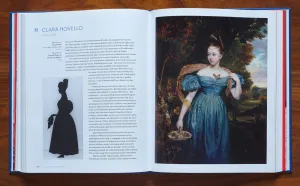 Book open to spread with a black silhouetted female figure opposite a painting of a woman outdoors in an elaborate blue silk dress