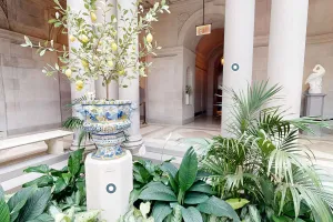 screenshot of a virtual tour showing a ceramic plant in a garden court