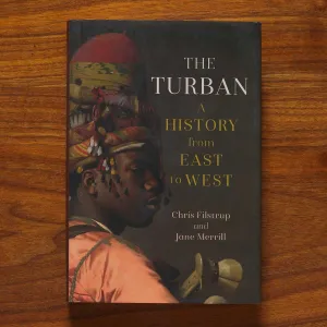 Book cover titled "The Turban" featuring a painting detail of a young man in a tall turban of various colors