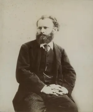 black and white photograph of Edouard Manet seated with hands folded in lap