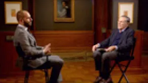 video still of  Xavier Salomon talking with Philippe de Montebello, both seated