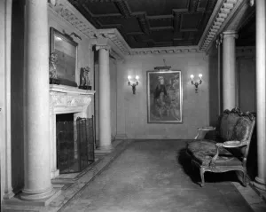 interior with bench seating, fireplace and columns