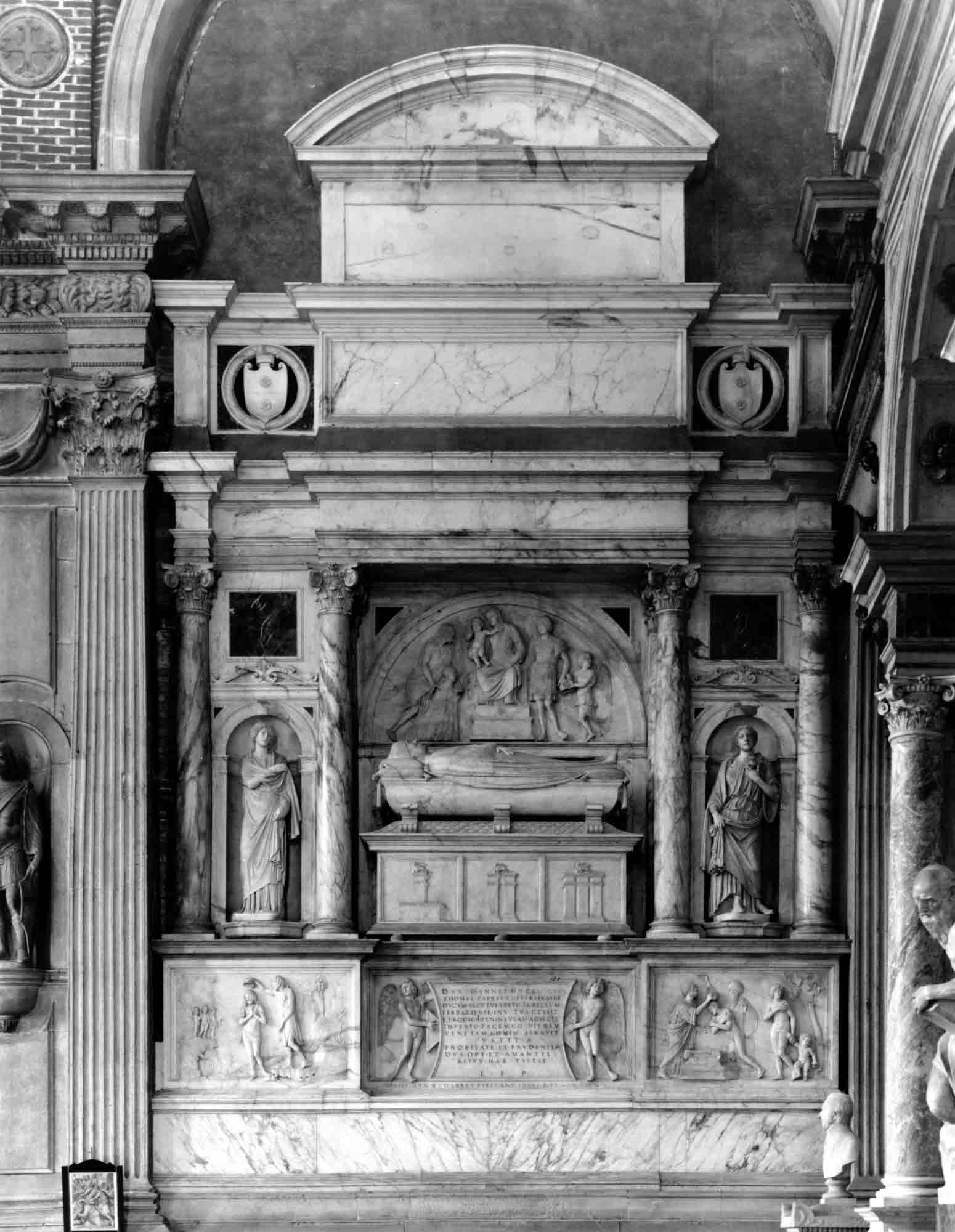 A black-and-white photograph of a Renaissance wall tomb in a Venetian church.